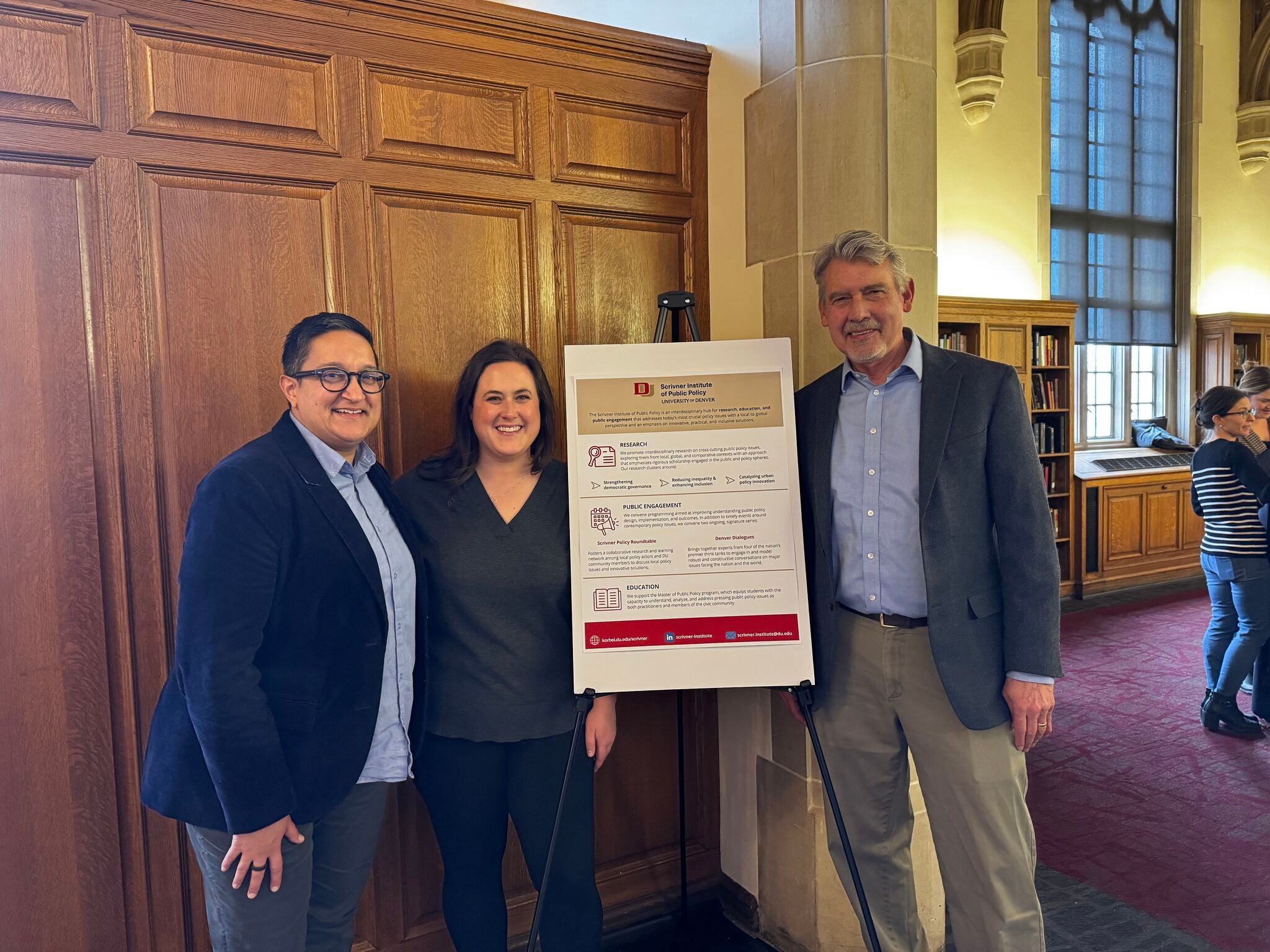 From left to right, Professor & Director of the Scrivner Institute Naazneen Barma, Associate Director of the Scrivner Institute Katie Aker, and Dean of the Korbel School Fritz Mayer celebrate Scrivner's research institute designation.