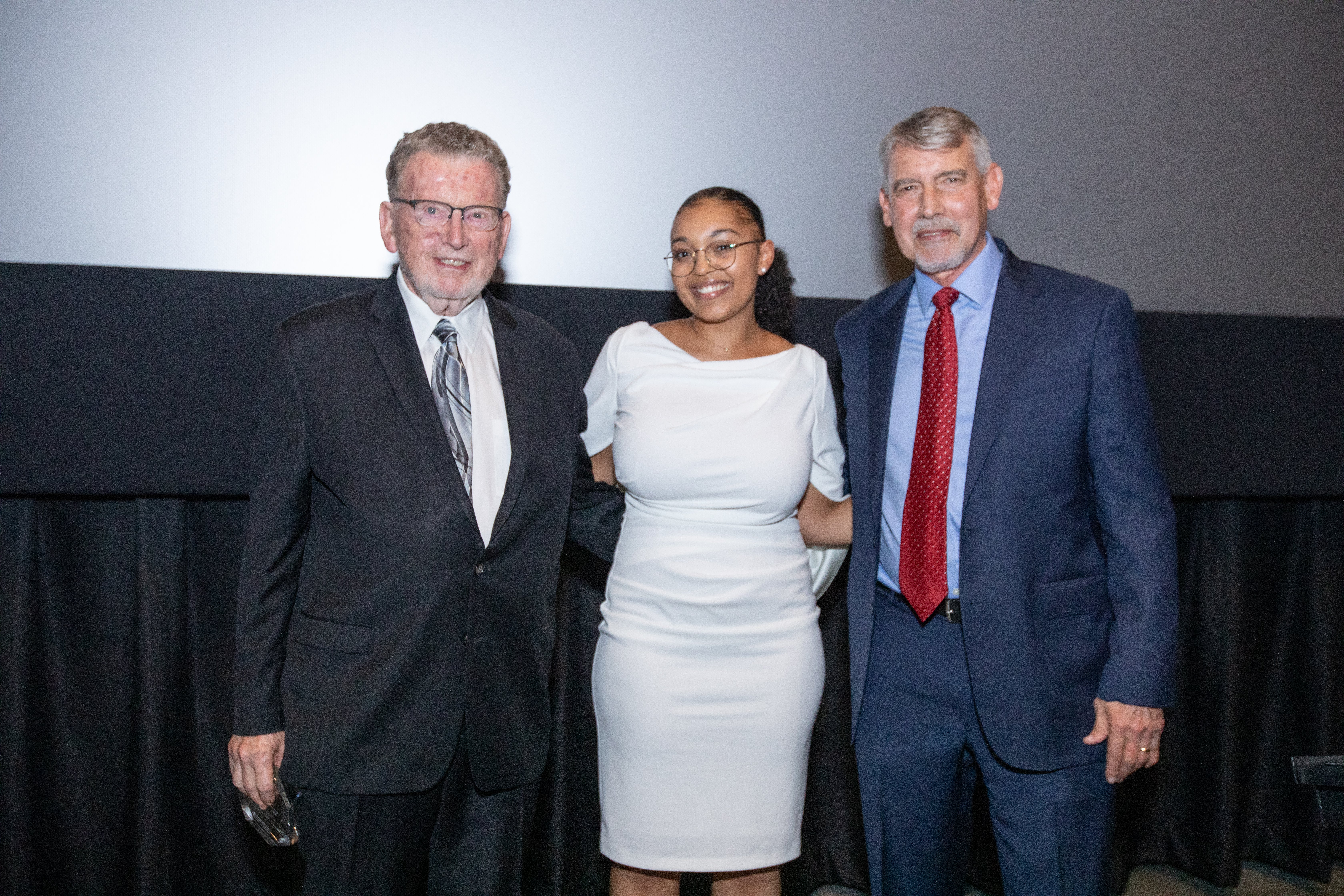 Tom Rowe poses with Korbel alumnus Kadijha Kuanda and Dean Fritz Mayer