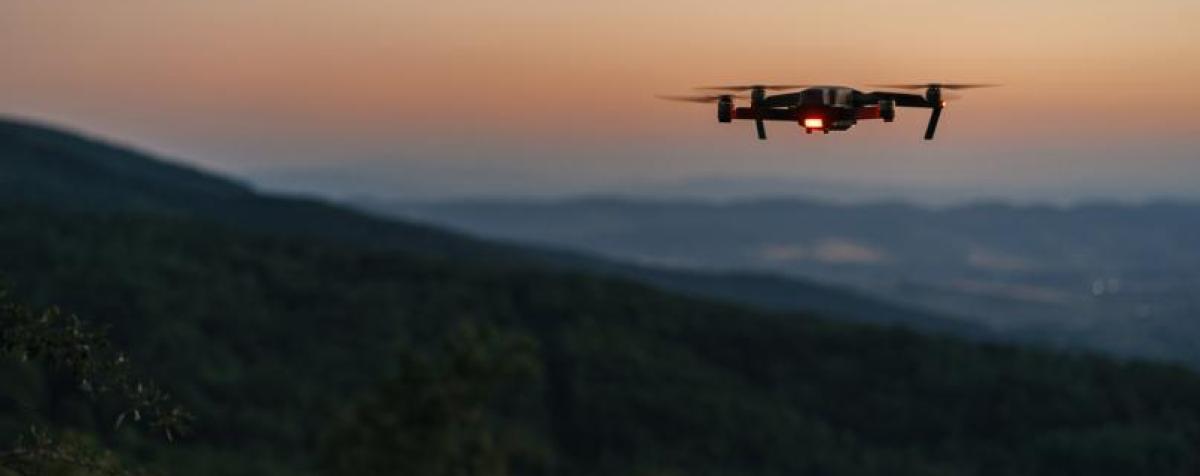 Drone over landscape at sunset