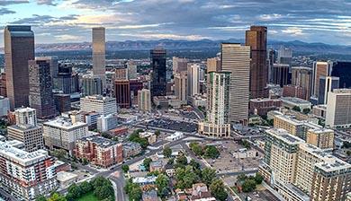 denver skyline with rocky mountains in the background 