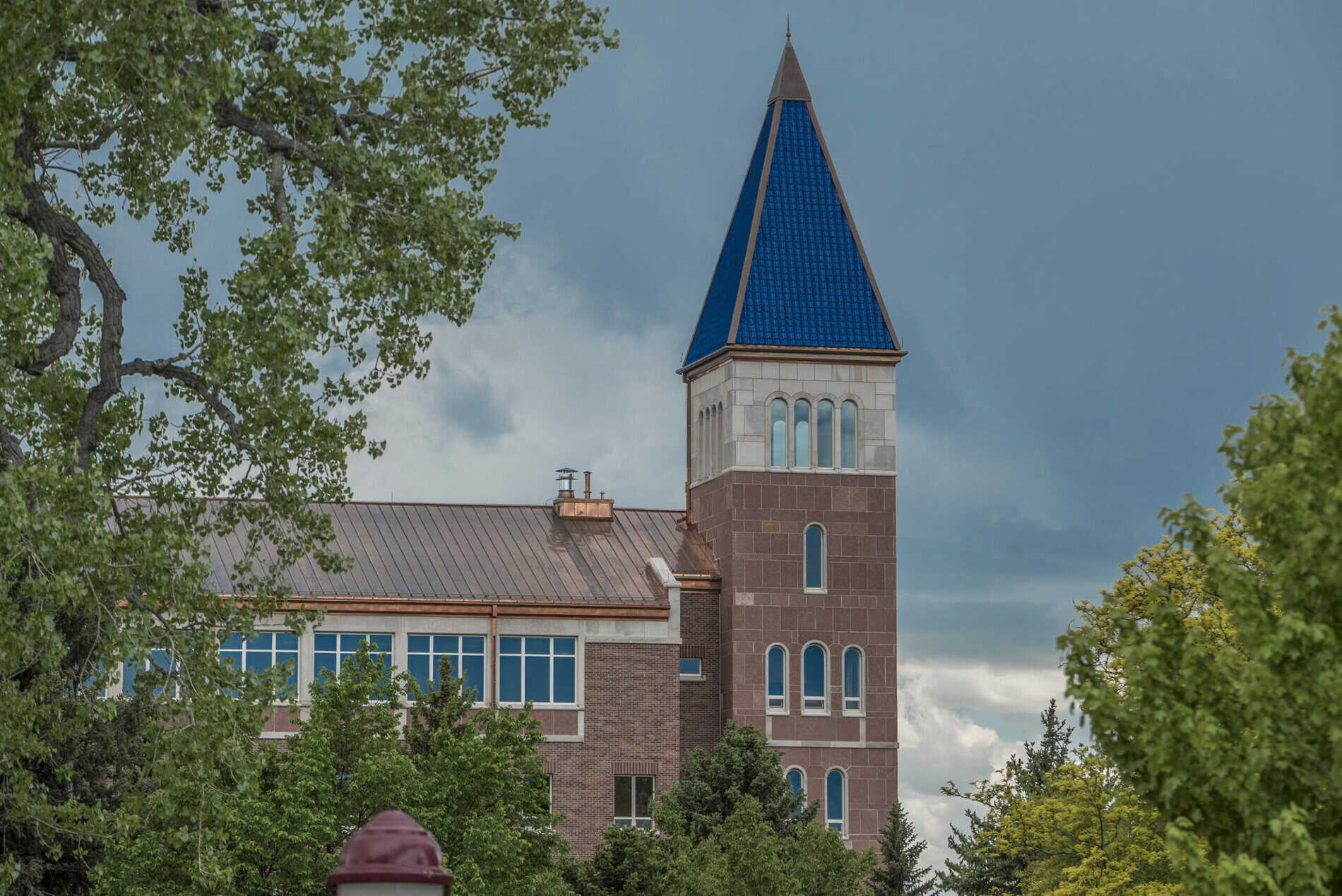 Exterior image of the blue spire of the Sie International Relations Complex.