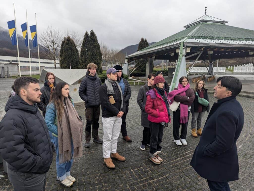 Korbel students talking to a tour guide in the Balkans.